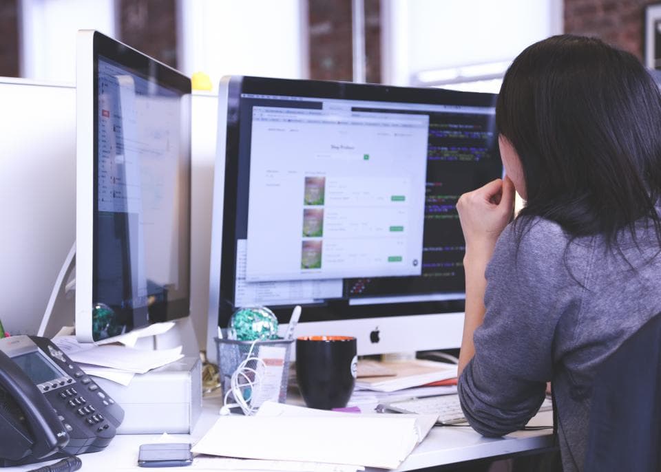 A support agent working at a computer